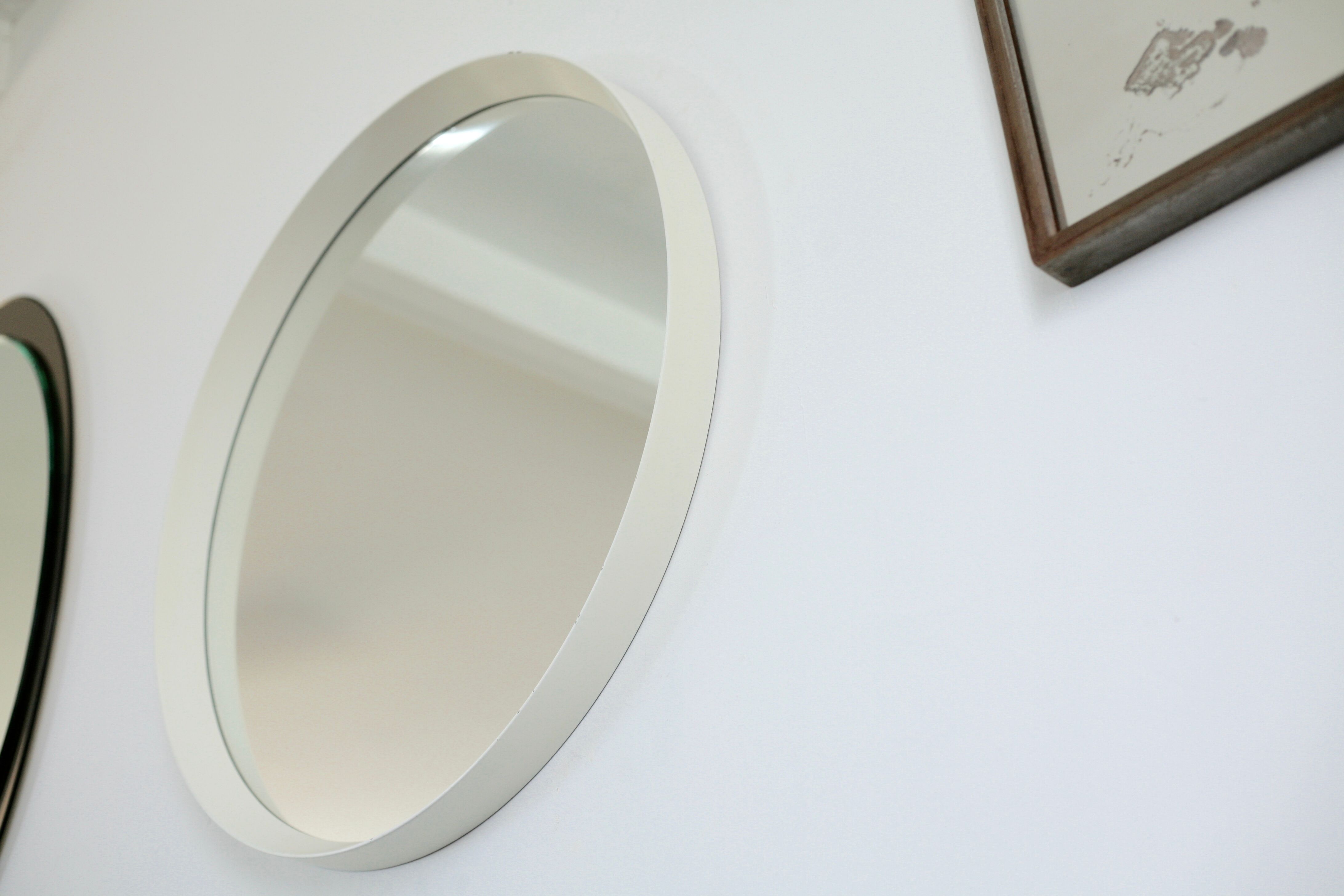 Circular mirror in "cream" laqué wood France circa 1960 68cm