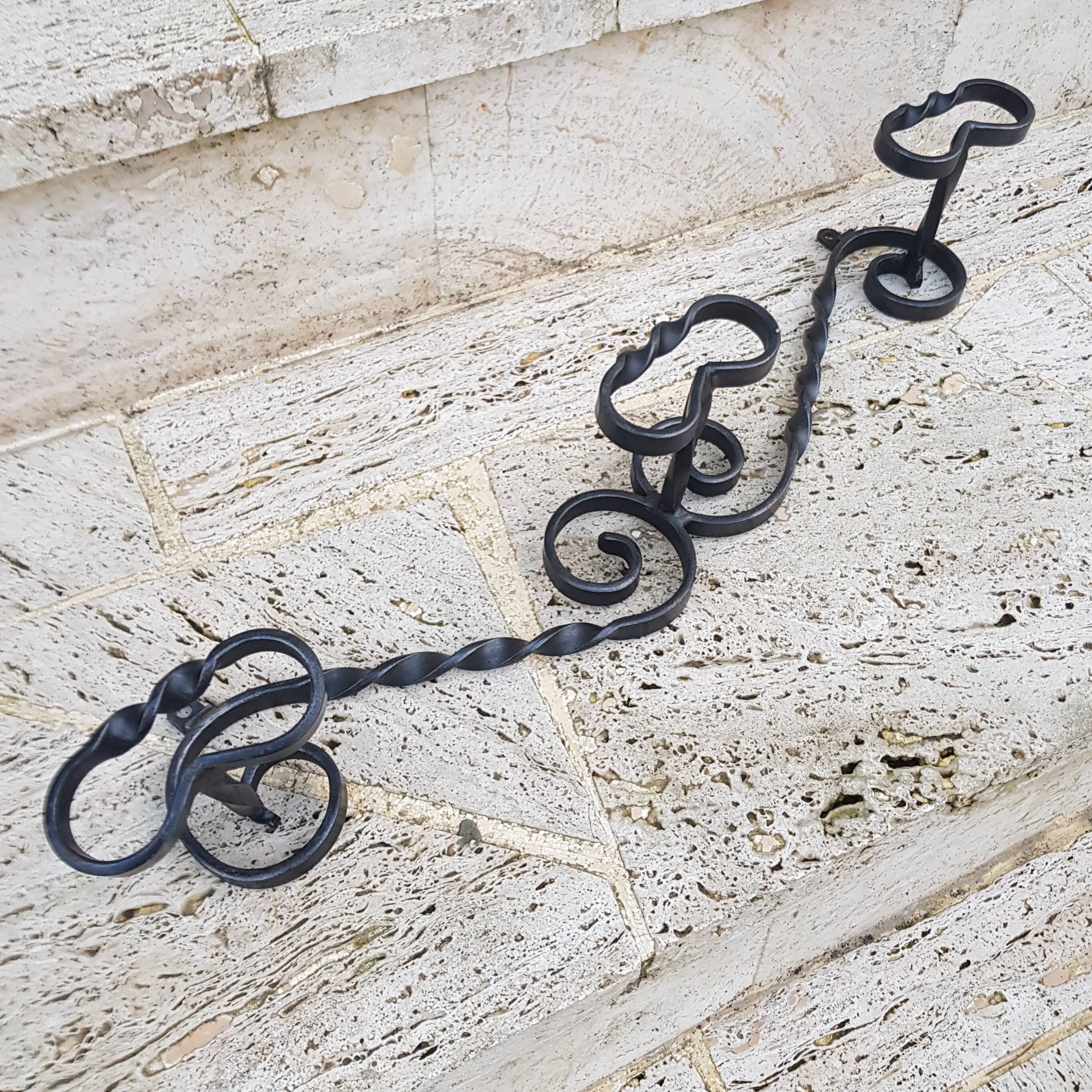 Wrought iron wall coat rack