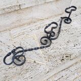 Wrought iron wall coat rack