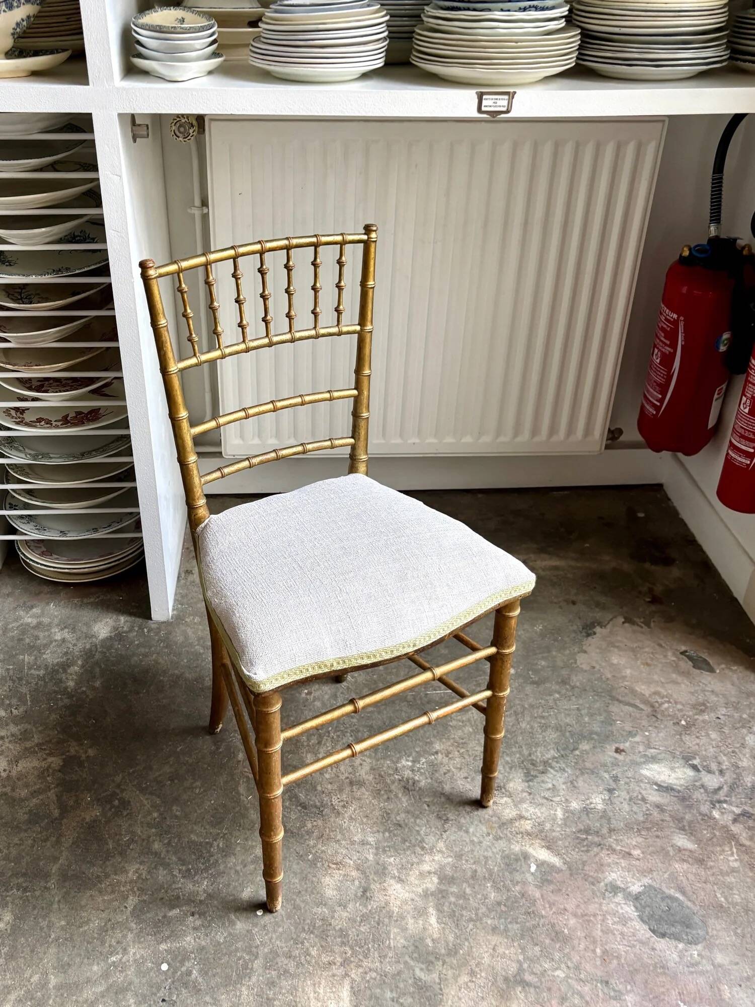 Napoleon III chair in gilded bamboo wood and beige cotton.