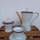 Coffee pot, sugar pot, 1 cup and saucer.