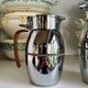 2 Hermès insulated jugs in chrome metal and covered leather.