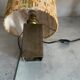 Small modernist table lamp with hand-woven shade.