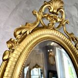Antique oval mirror from the 20th century