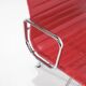 "EA 108" armchair in red leather, designed by Charles and Ray Eames for Vitra,