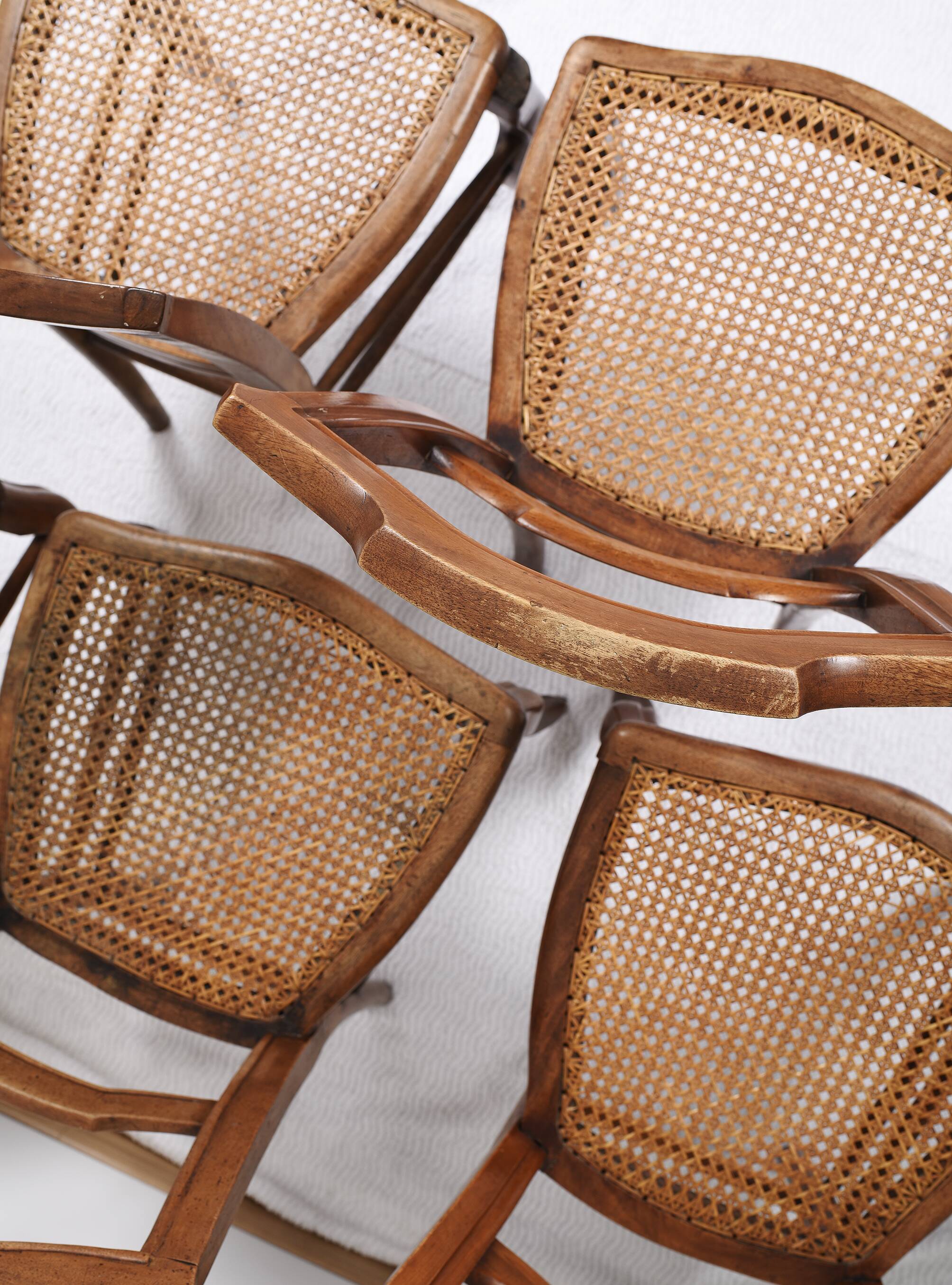Set of 5 old cane chairs.