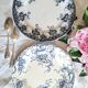 Antique earthenware dessert plates accompanied by a dish