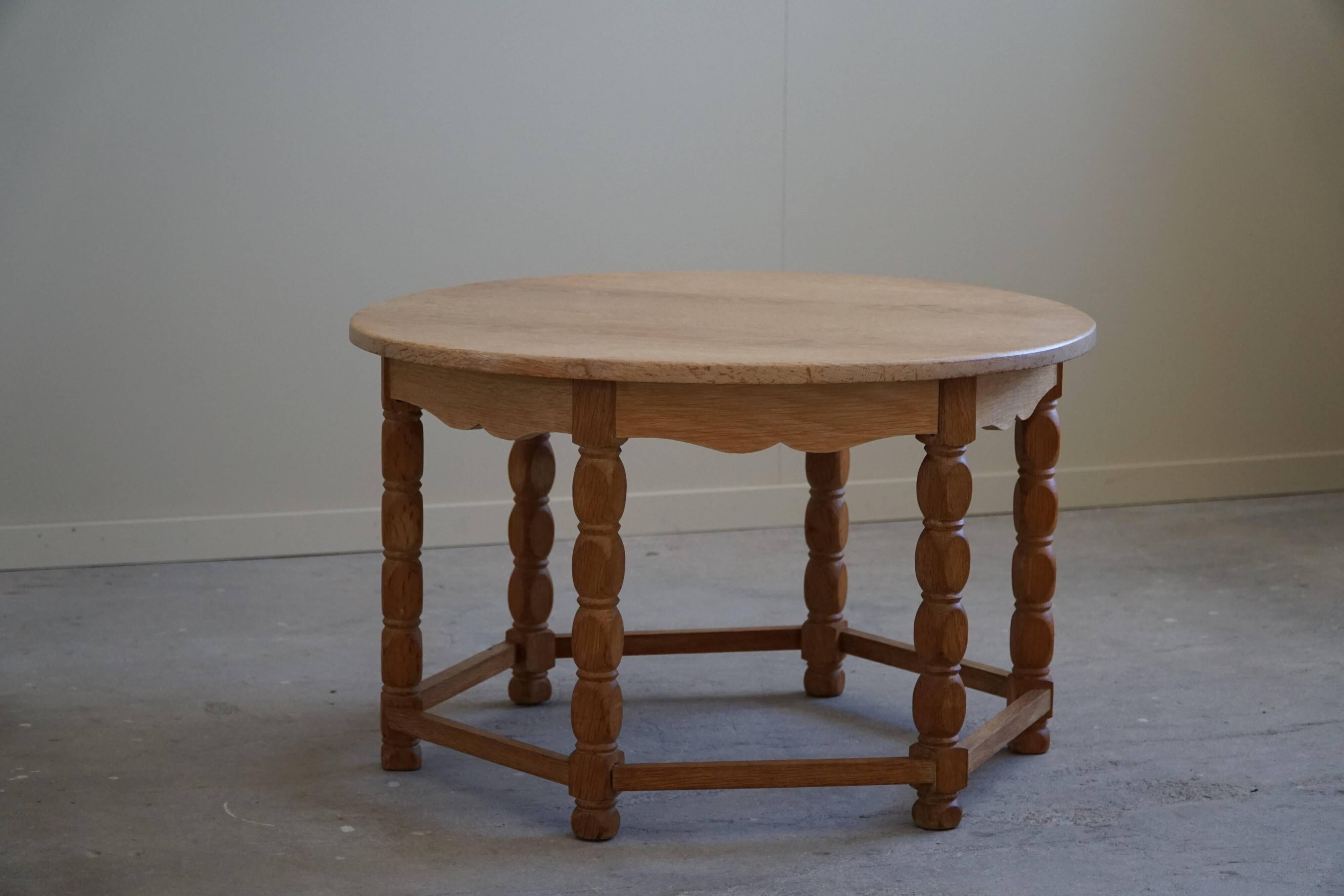 Danish modern and brutalist round coffee table in solid oak, 1960s.