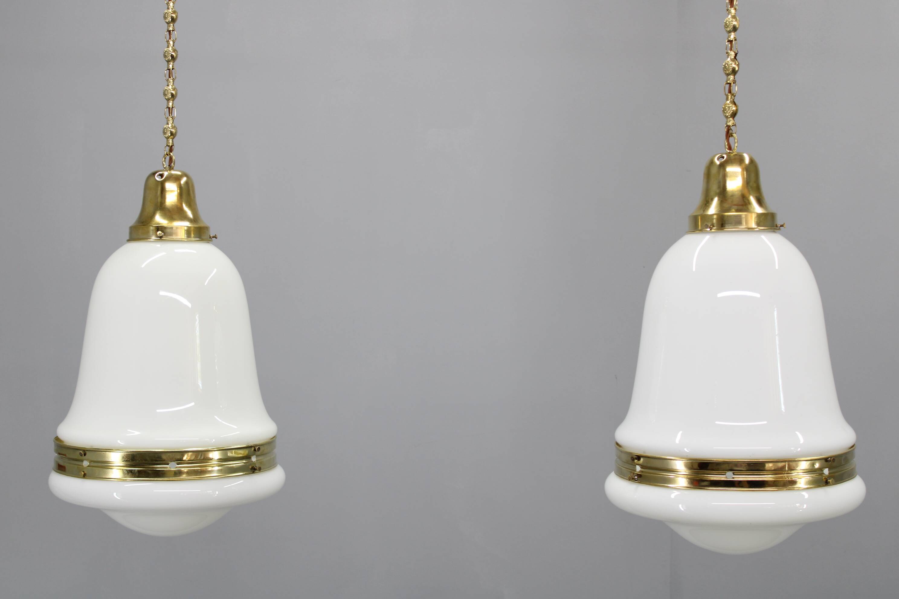 Pair of 1930s Peter Behrens Luzette pendants in opaline glass and brass