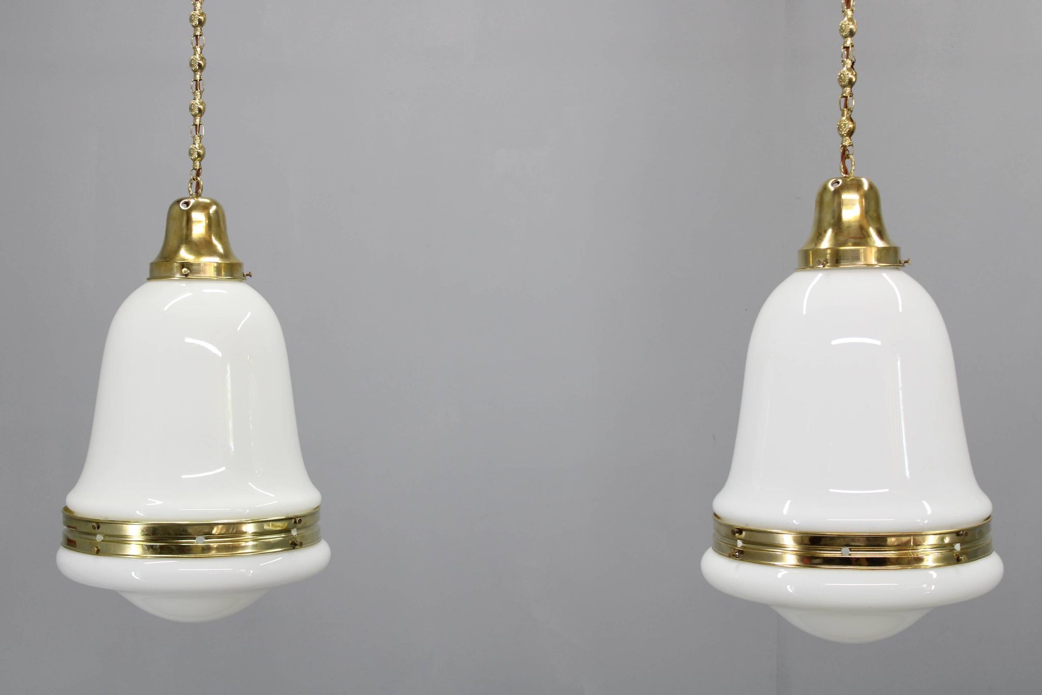 Pair of 1930s Peter Behrens Luzette pendants in opaline glass and brass