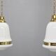 Pair of 1930s Peter Behrens Luzette pendants in opaline glass and brass