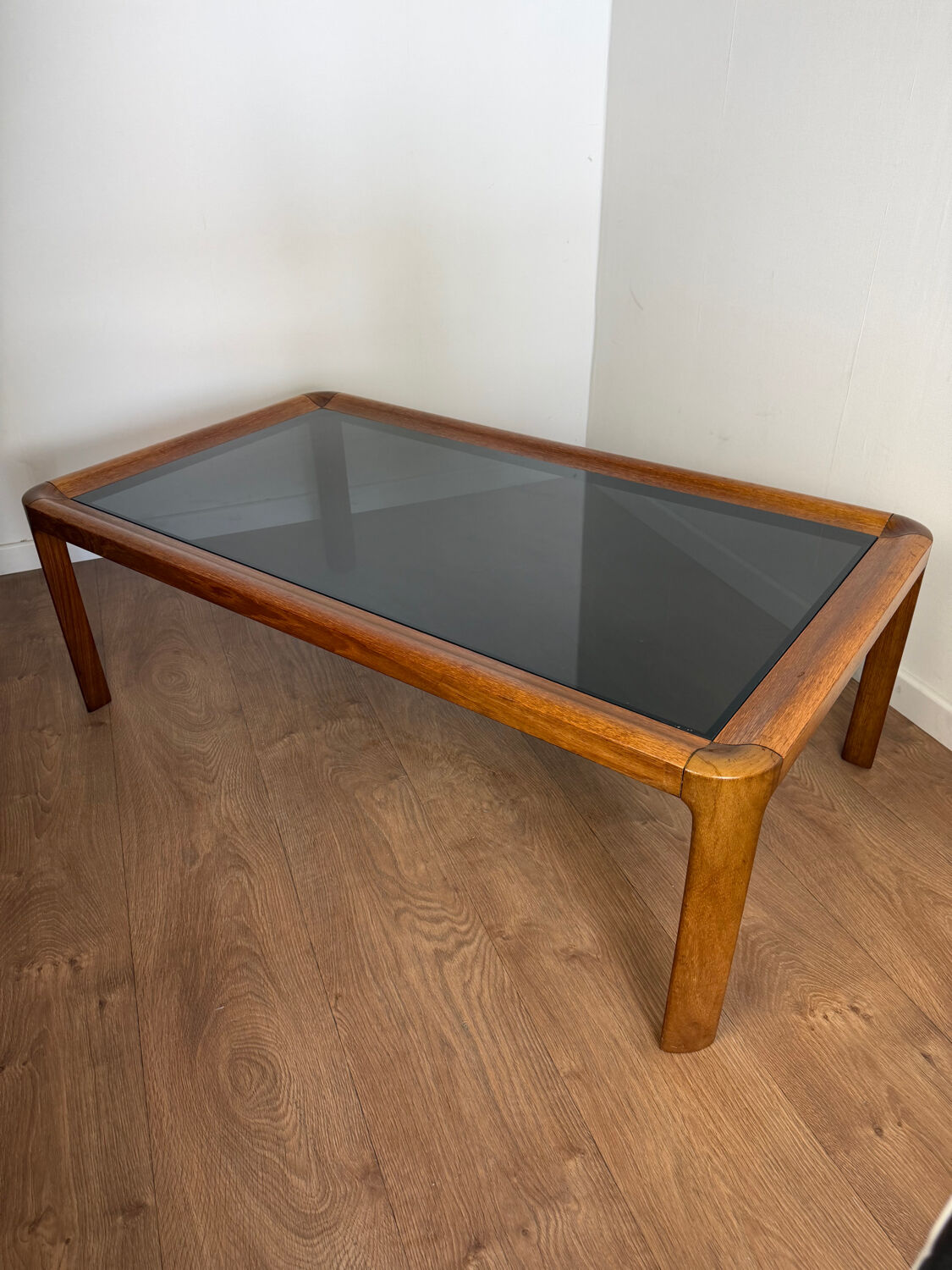 Large Scandinavian coffee table in teak and smoked glass.