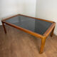 Large Scandinavian coffee table in teak and smoked glass.