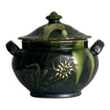 Pot à condiment en céramique verte, décoré de motifs floraux.