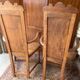 Pair of carved walnut armchairs in Renaissance style