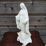 Ancient statuette of the virgin with the serpent in biscuit