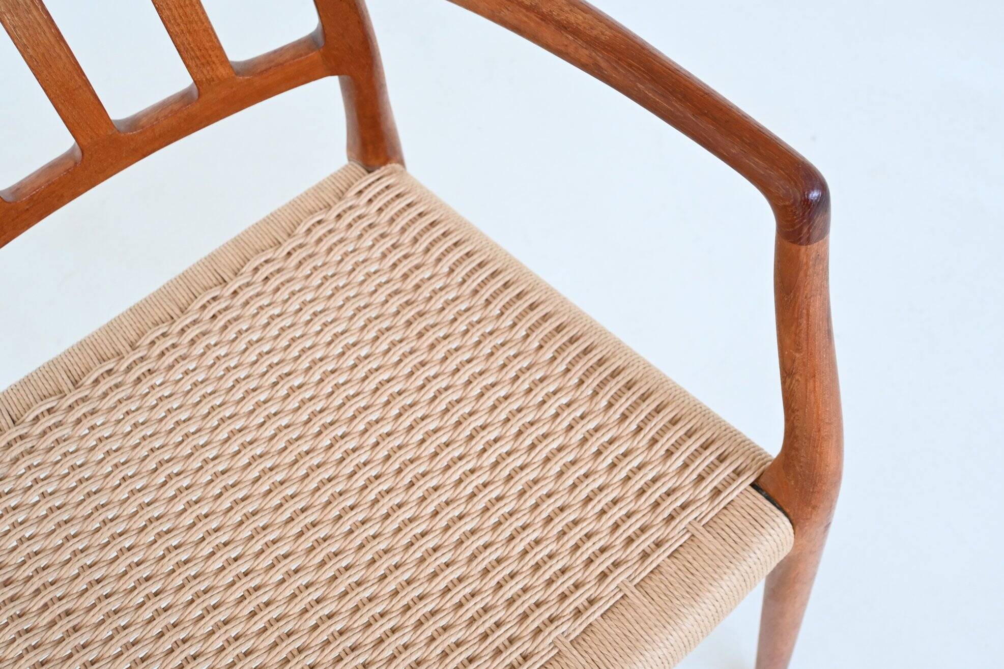 Niels Otto Moller model 66 armchairs teak and paper cord Denmark 1974