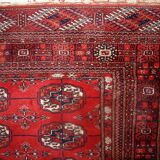 Tapis vintage fait main Tekke en laine rouge (109cm x 112cm) – Années 1970