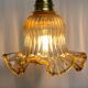 Gold bent wall light vintage tulip in amber glass.