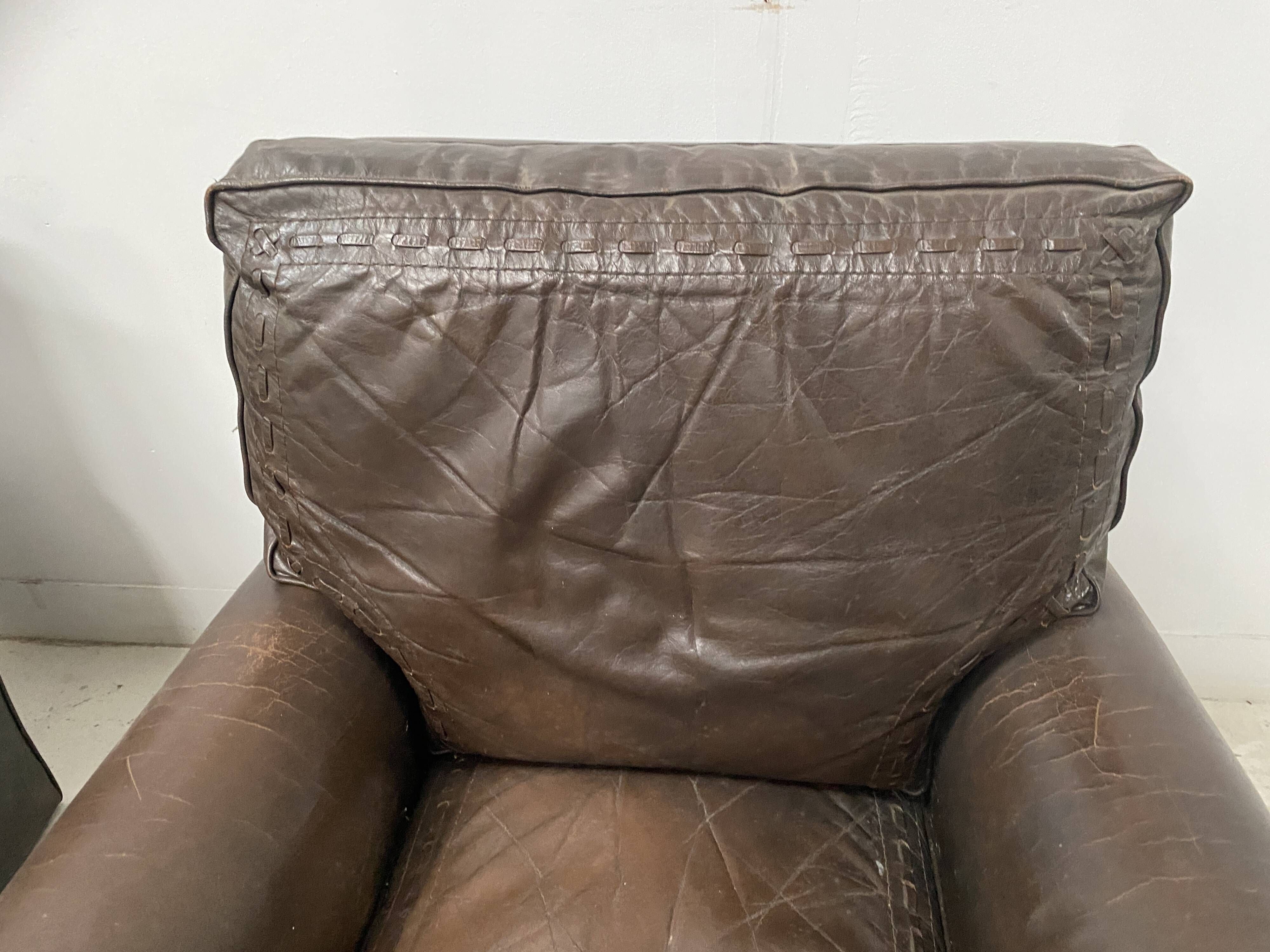 Pair of vintage brown leather armchairs from the 1970s.