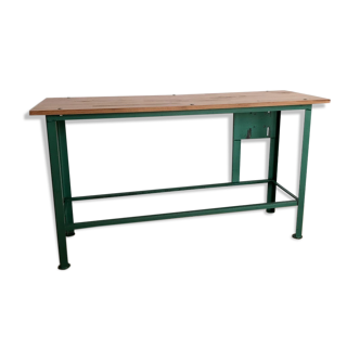 Industrial workbench in green metal tray being massive