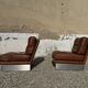 2 armchairs and 1 ottoman in brushed aluminium and brown leather, France, 1970.