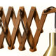 Solid teak wall lamp/Scissor lamp with brass coloured aluminium shade.