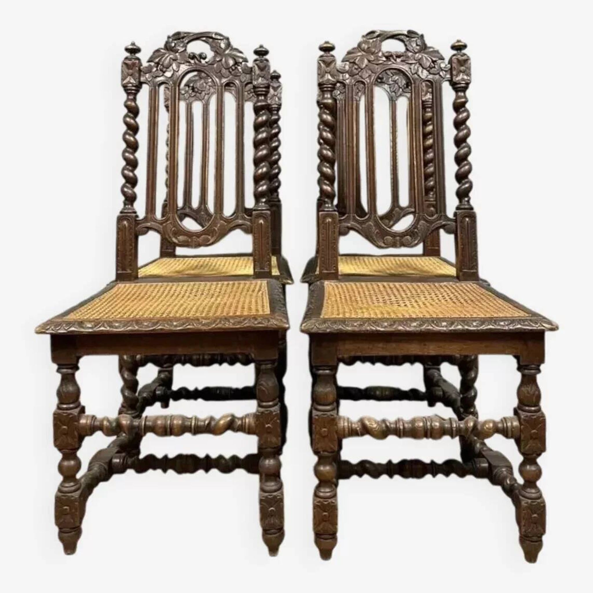 Set of 4 Renaissance style hunting lodge chairs in carved oak