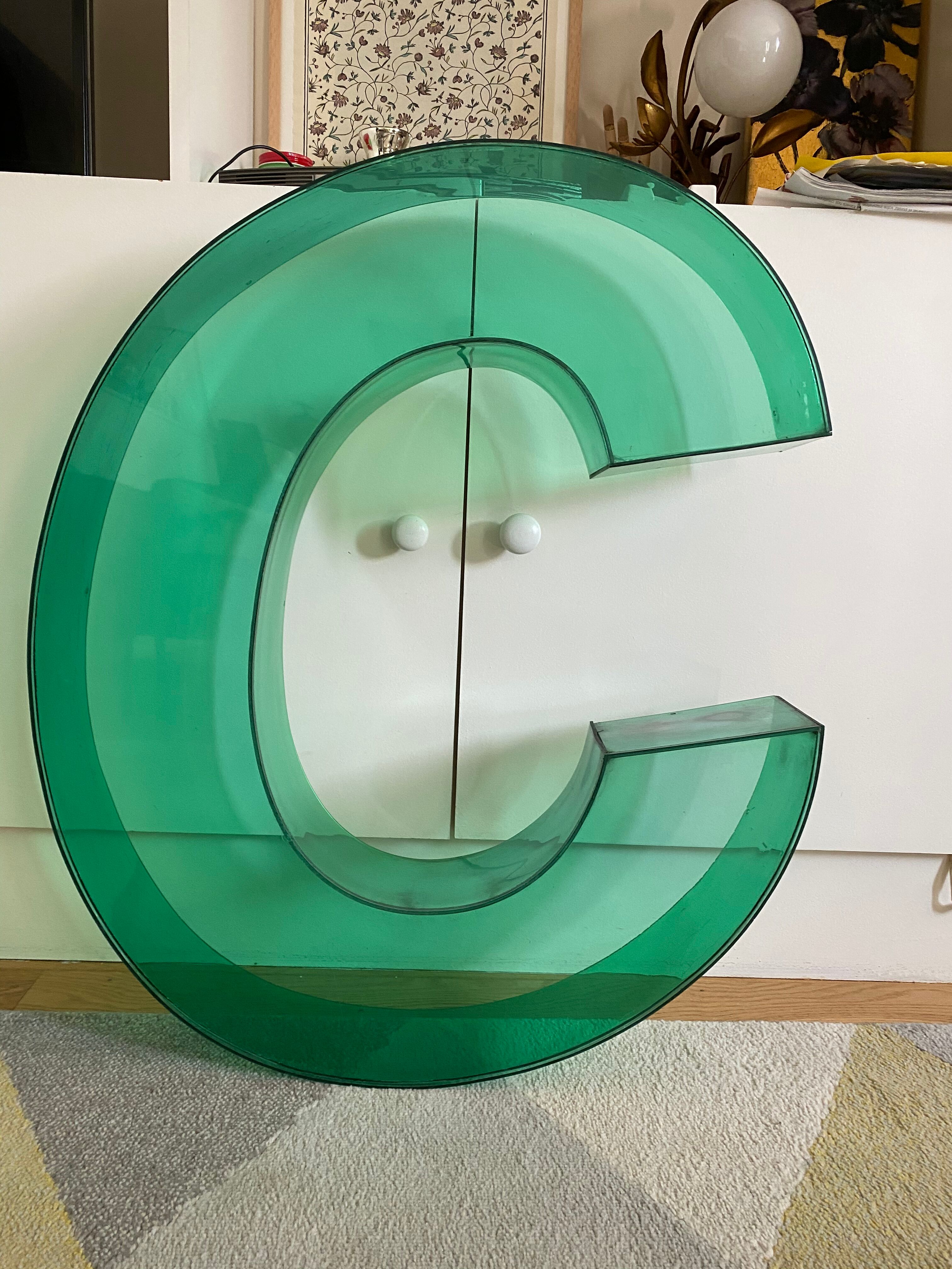 Letter signs C in transparent plexiglass