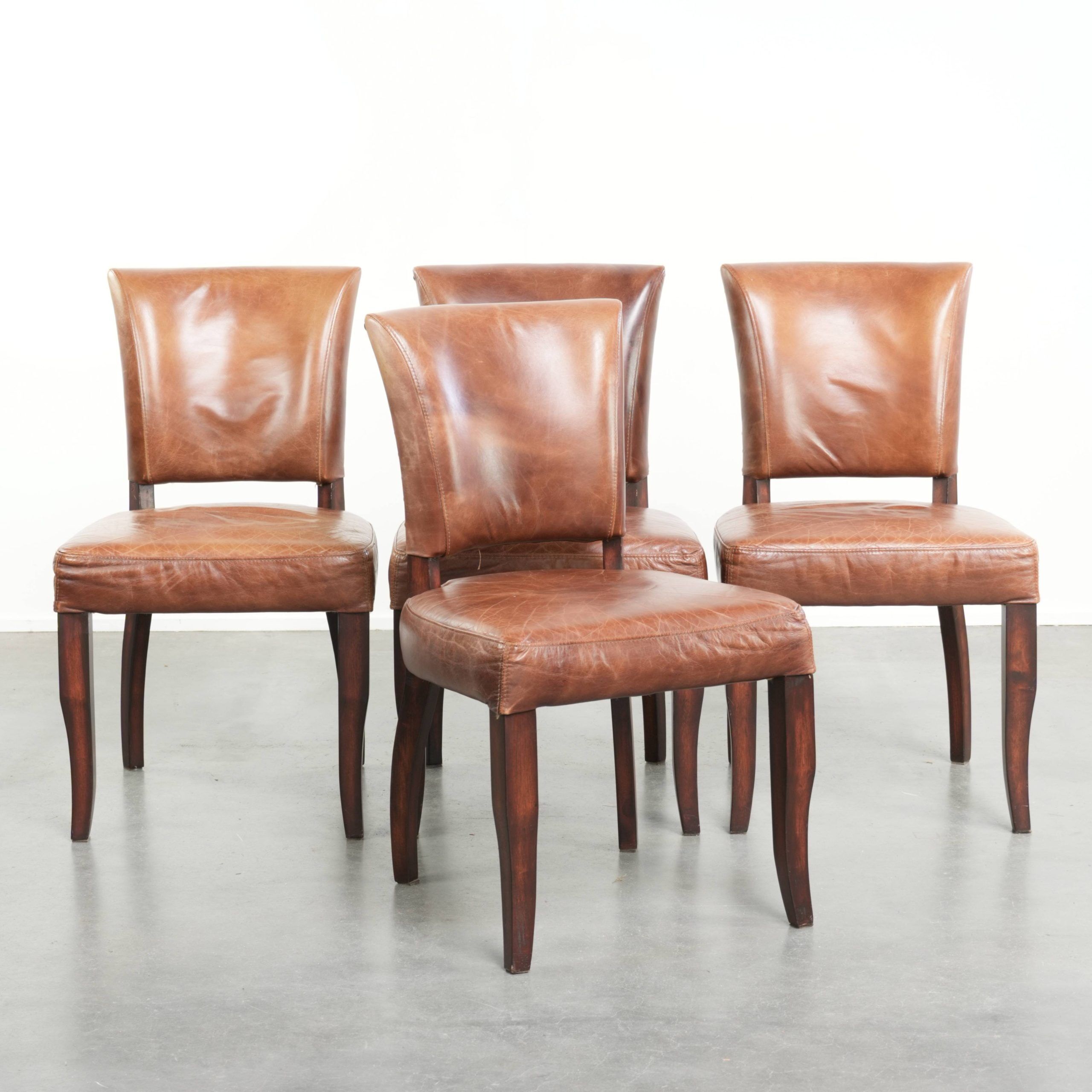 Set of 4 cognac-coloured cowleather dining chairs with decorative nails