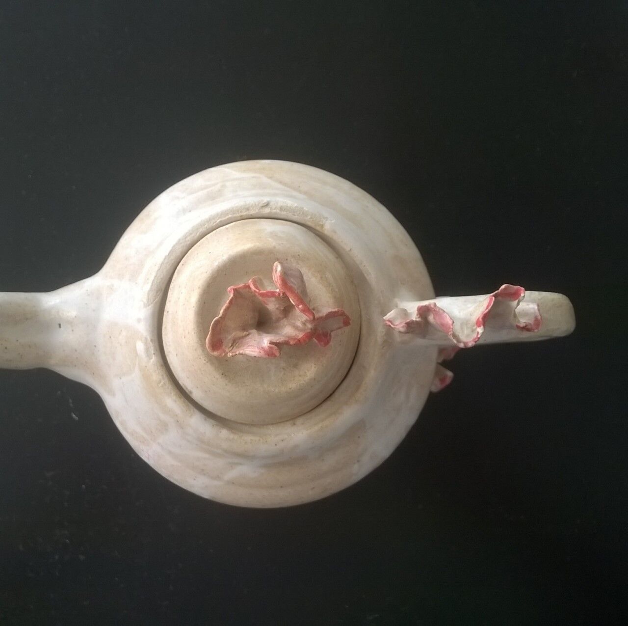 Vintage teapot with relief coral decoration.