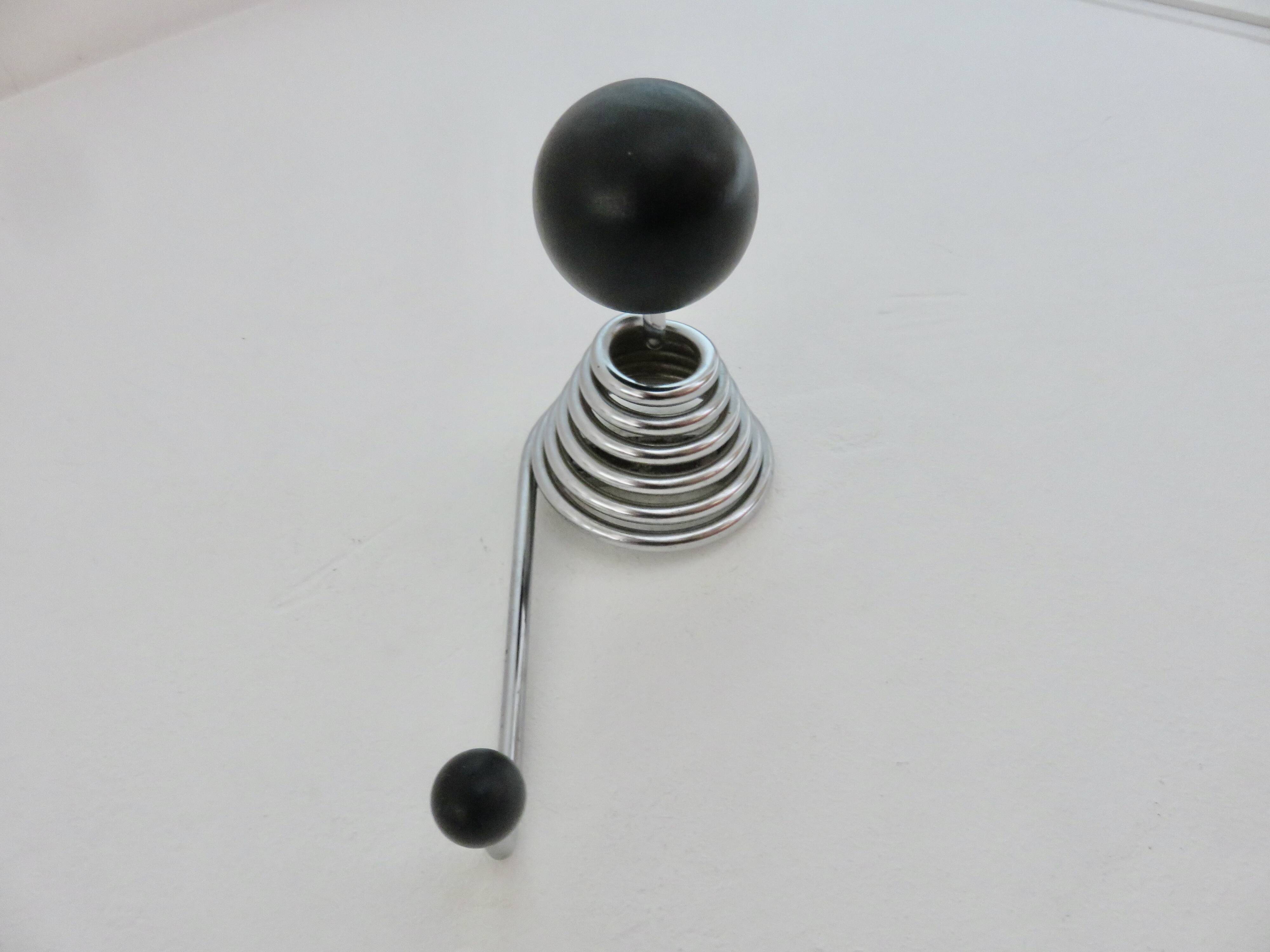 "Streamline" wall coat rack in chromed metal and black lacquered wood, 1970.