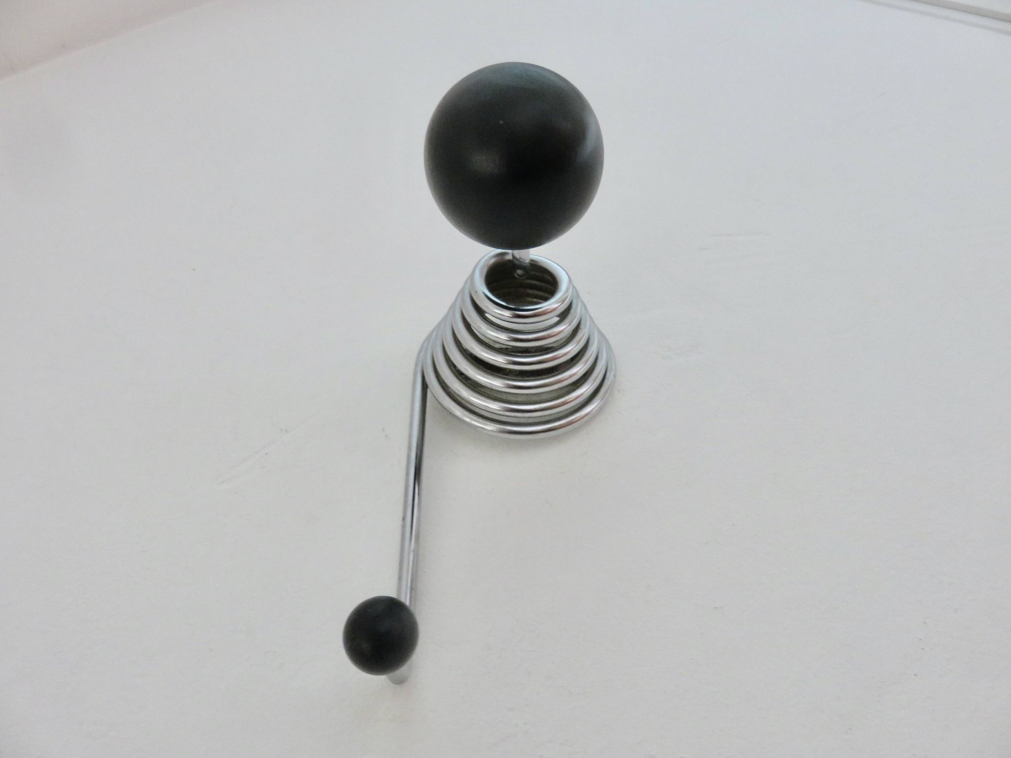 "Streamline" wall coat rack in chromed metal and black lacquered wood, 1970.