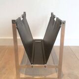 Magazine rack in brushed steel and leather, in the style of Poul Kjaerholm