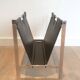 Magazine rack in brushed steel and leather, in the style of Poul Kjaerholm
