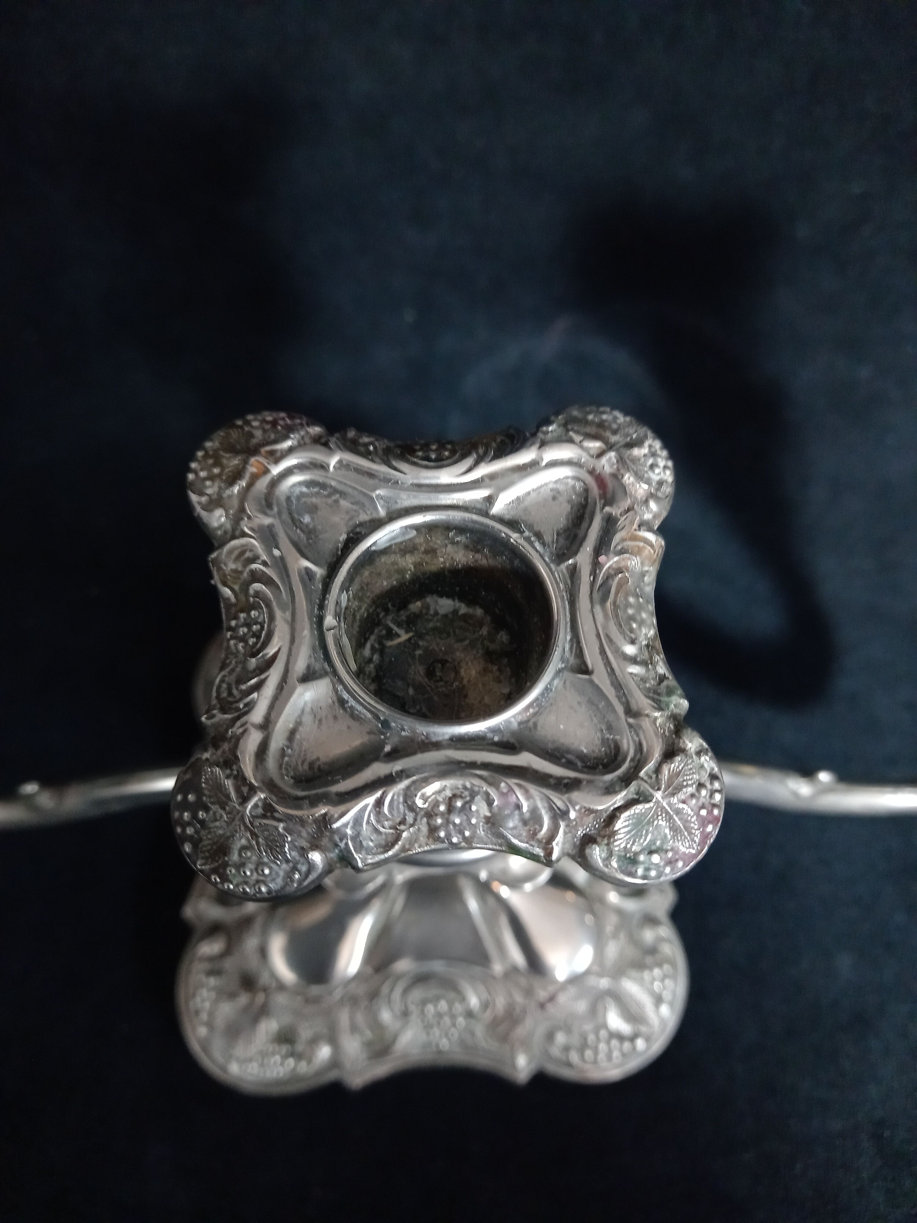 English silver metal candelabra decorated with vine leaves