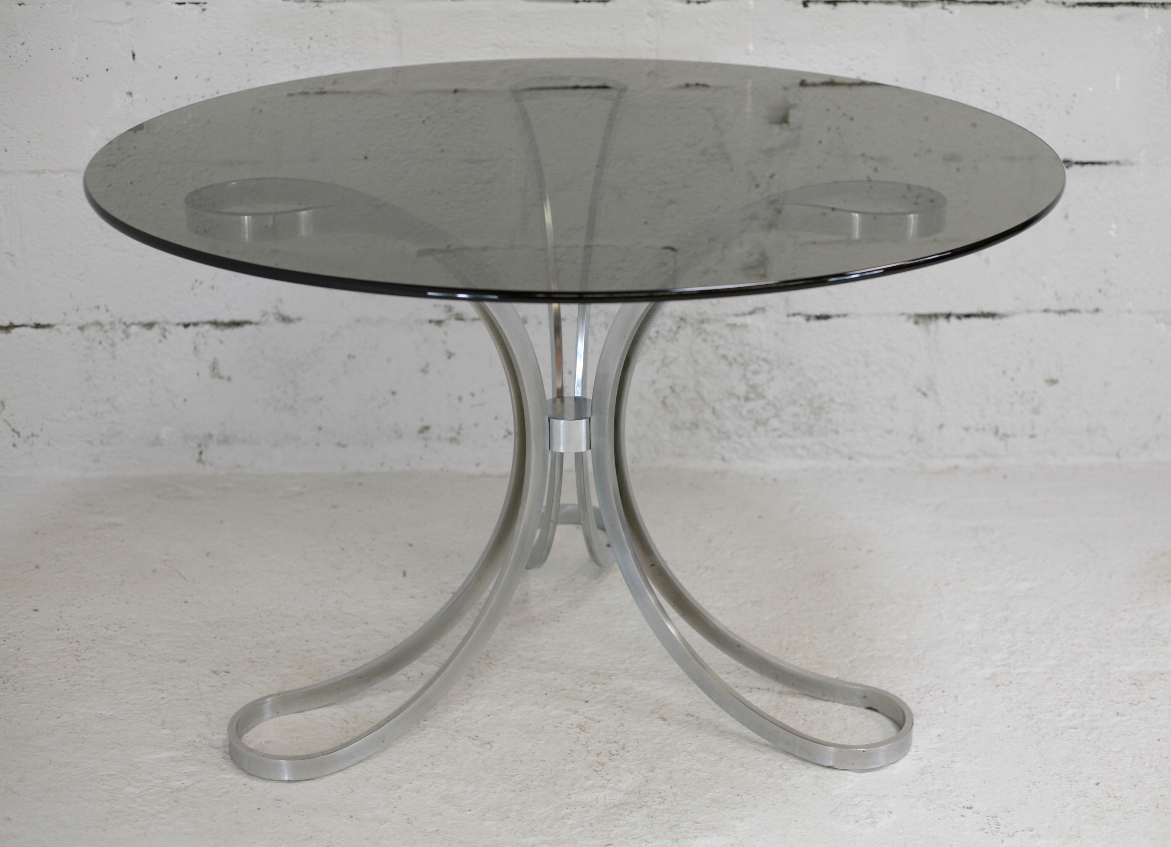 Living room table "Space Age" polished steel, circular slab smoked glass. France, circa 1970.