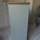 Vintage shoe cabinet green of gray, wooden top.