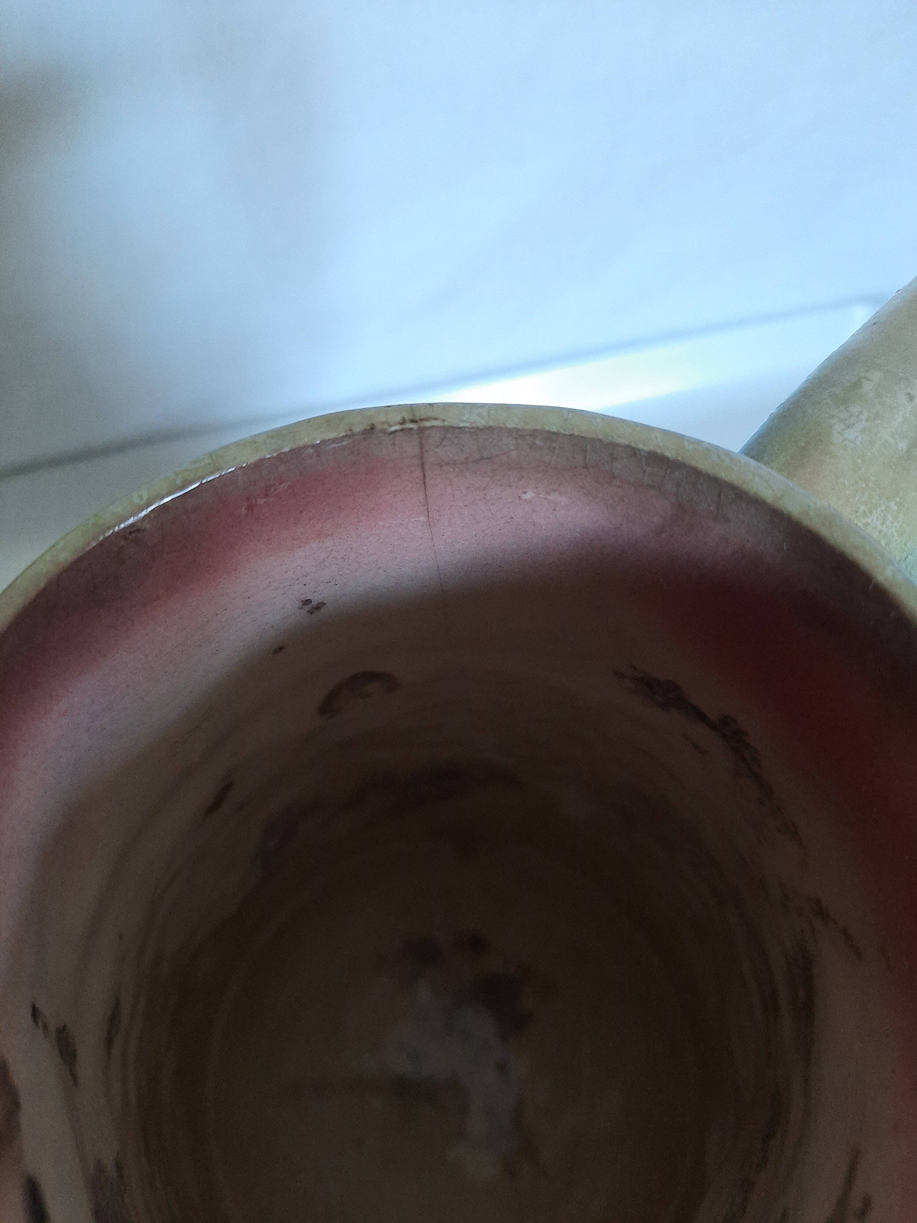 Slush pitcher. Pansy pattern on wicker basket background. Green and pink.