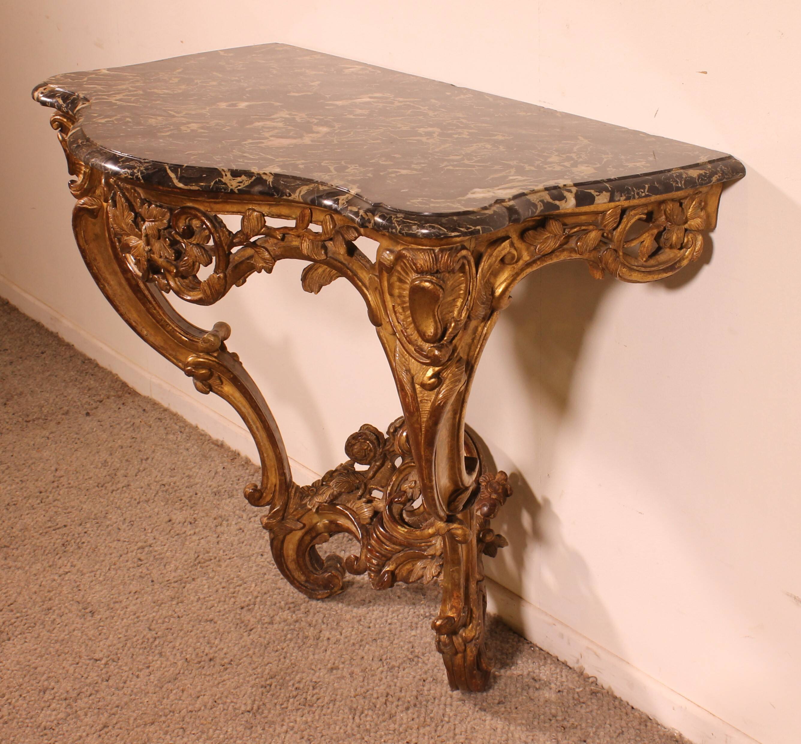 Louis XV period console in gilded wood