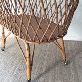 Vintage rattan cradle with its spire
