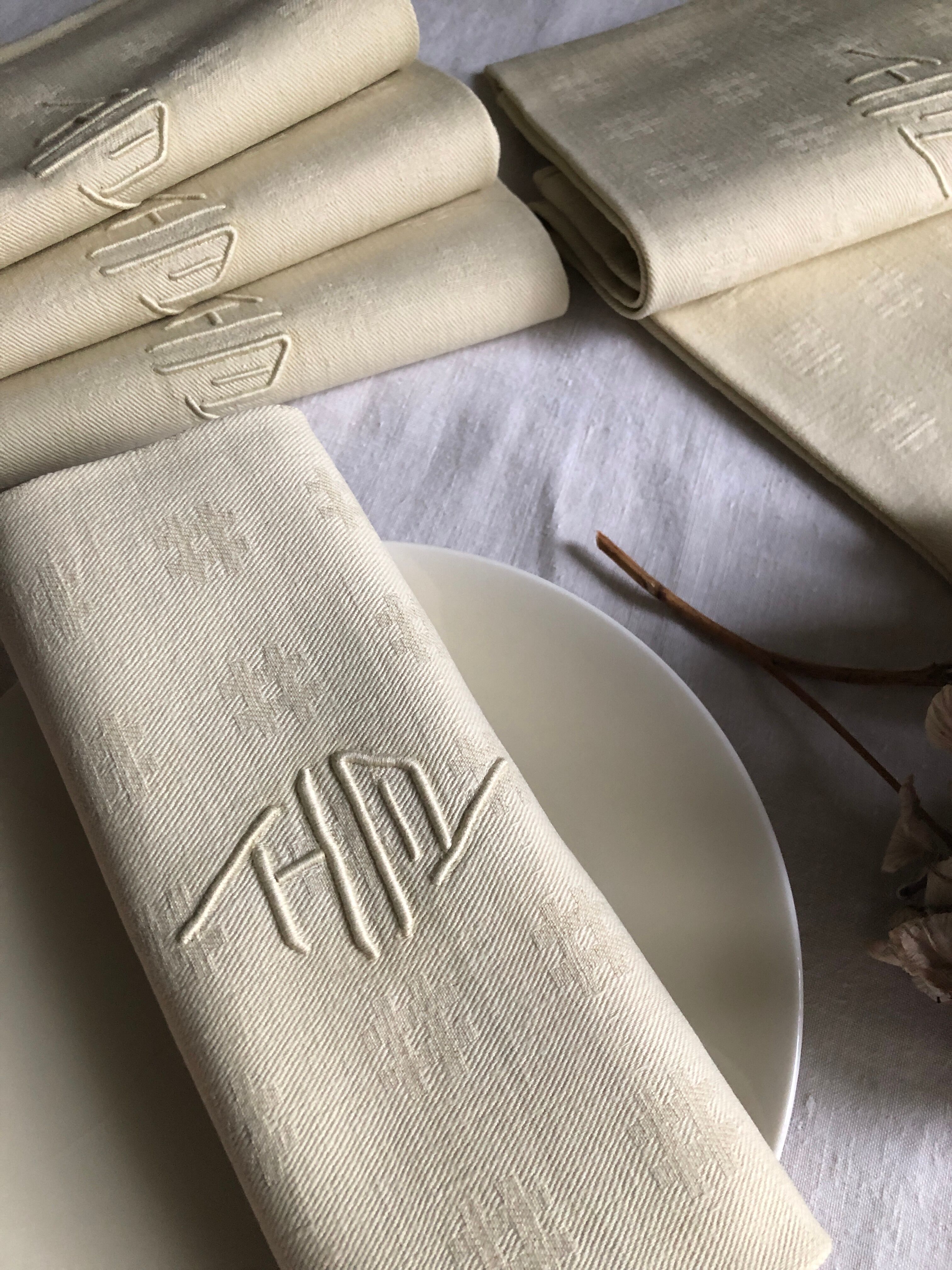 Antique napkins damascus and monogrammed tinted fresh butter