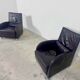 Pair of aubergine leather club armchairs by Cinna.