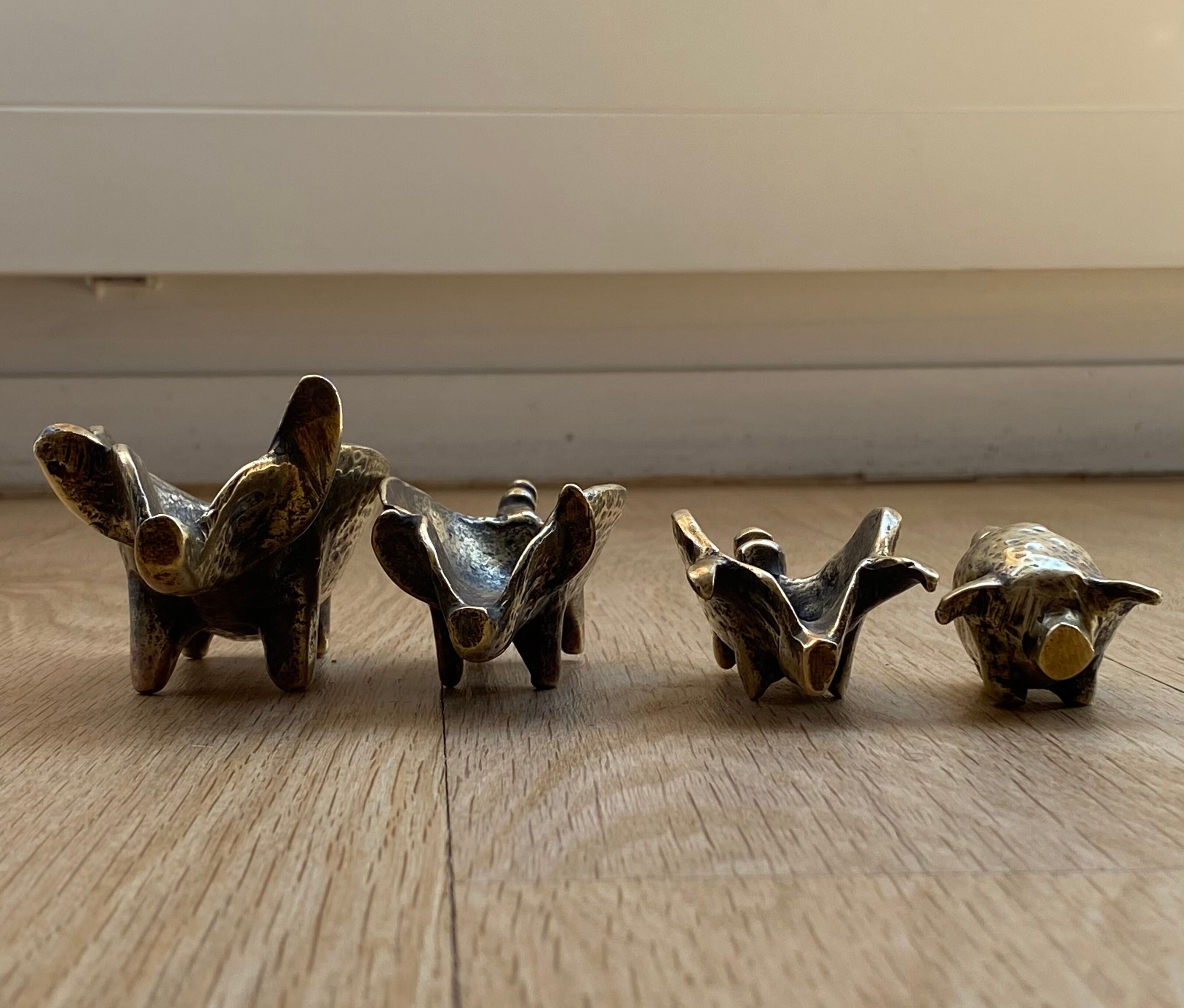 4 Pfizer bronze ashtray pigs