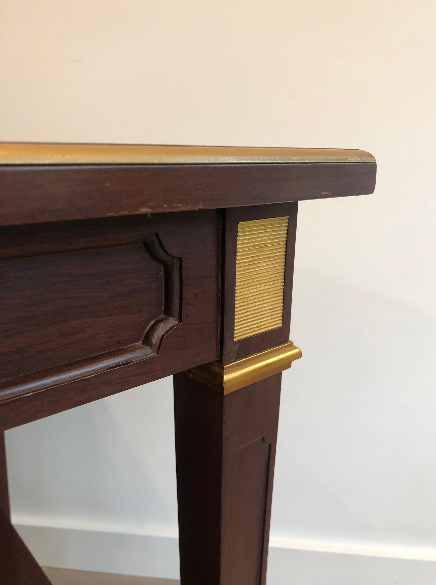 Two-level table in mahogany and brass
