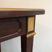 Two-level table in mahogany and brass