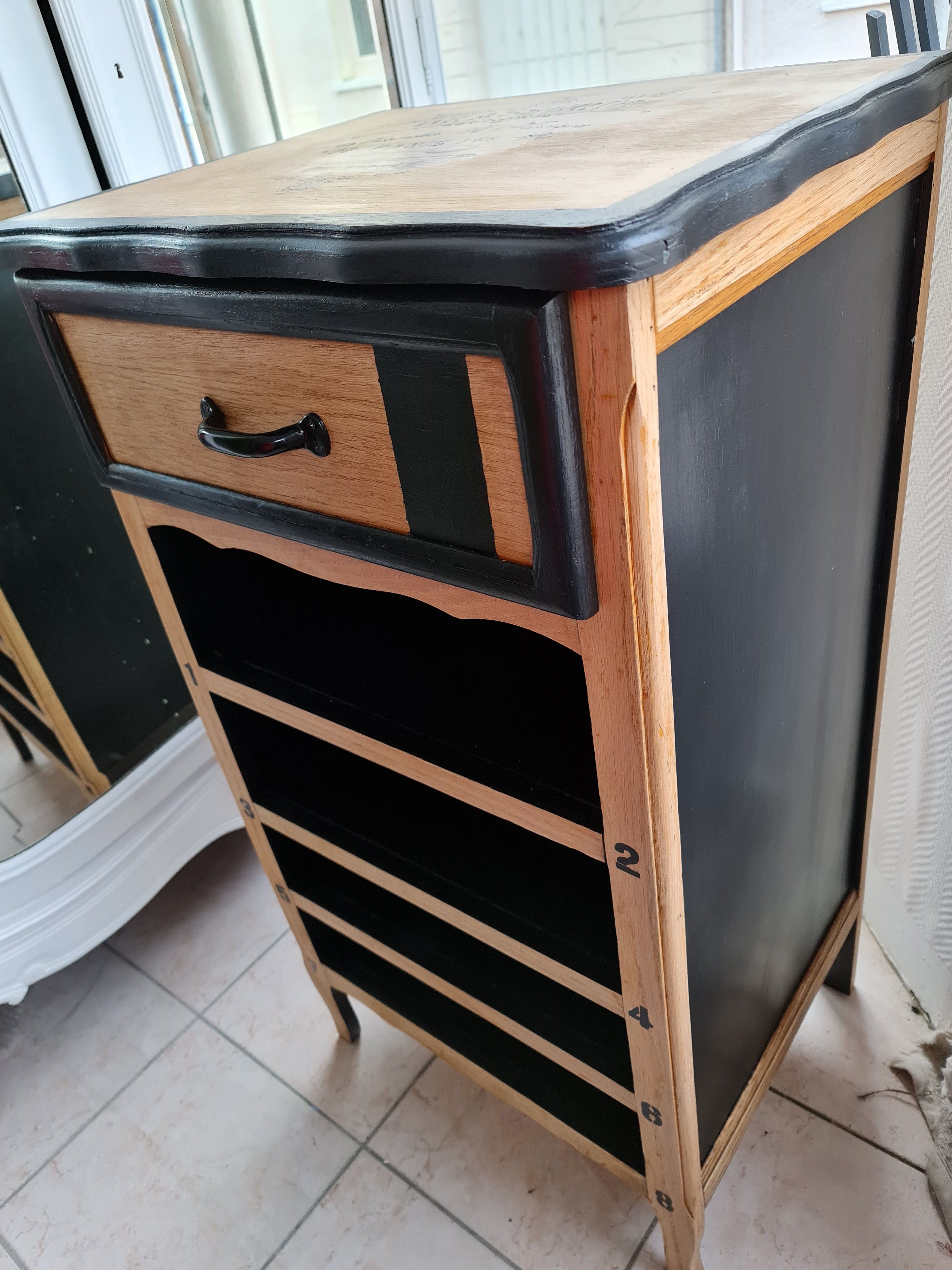 Raw oak and matte black storage cabinet on stencil top and transfer