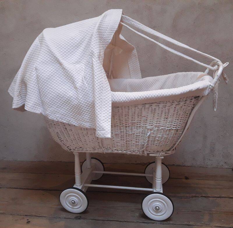 Wicker and painted wood baby cradle