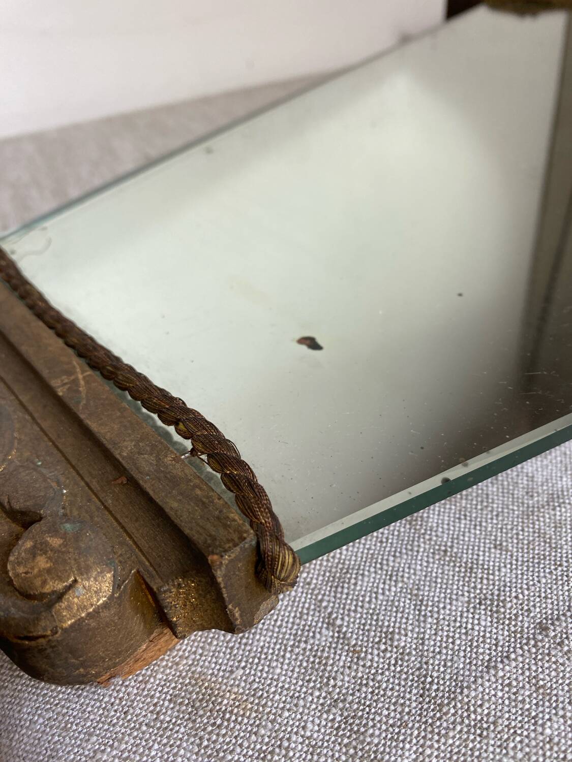 Antique wooden mirror with an unusual shape