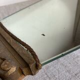Antique wooden mirror with an unusual shape